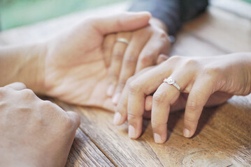 Forever is long, but not long enough with you. Cropped shot of a man putting an engagement ring onto his fiancees finger outdoors.