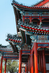 Traditional Chinese architecture with vibrant red pillars and intricate roof details