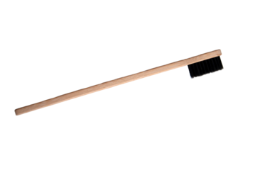 A wooden toothbrush isolated on a white background. An eco toothbrush.