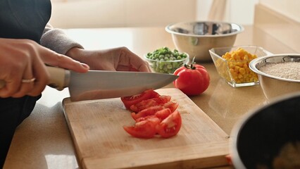 Preparing vegetables for a healthy meal with fresh ingredients on a cutting board