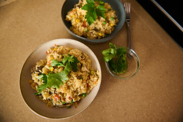 Healthy Vegetarian Paella With Fresh Herbs Served in Ceramic Bowls