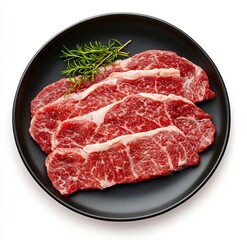 Fototapeta premium Succulent Beef Cuts on a Dark Plate with Fresh Herbs Gourmet Culinary Flat Lay Photography