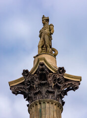 Obraz premium Sculpture of Admiral Nelson on column in Trafalgar square, London, UK