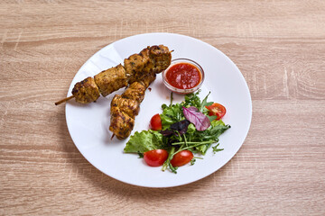 Grilled Chicken Skewers with Salad and Sauce