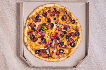 Pizza with Pepperoni, Peppers, and Olives in a Takeaway Box