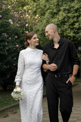 A Beautiful Romantic Wedding Kiss Set Against a Stunning Floral Background Scene