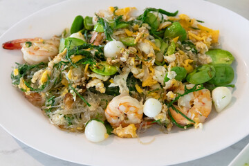 Stir fried stinky vegetables. Stir-fried shrimp noodles asian cuisine gourmet dish indoor setting close-up view flavorful experience