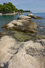 Obraz premium Landscape with rocky shore of the Adriatic Sea. Rocky spit in the sea