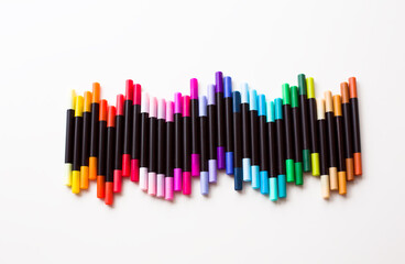 Vertical Row of Markers on White Background