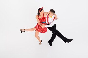 Photo of attractive couple professional dancers choreographers dancing jazz funk rock roll isolated...