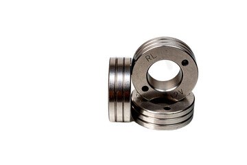 Set of metal washers on white background. Three round thick metal washers. industrial hardware for assembly and fastening.