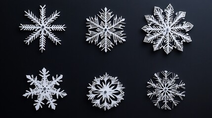 Elegant Paper Cut Snowflakes Against Dark Background