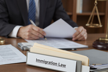 An image depicting a professional legal setting with a focus on immigration law desk plate