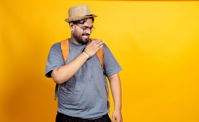 Happy Indian young Man with back pack on looking towards the empty space