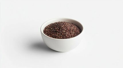 Close-up of black quinoa seeds in a small white bowl against a white background.