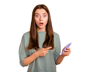 Photo of shocked disquieted girl dissatisfied with her new phone while isolated with vivid yellow background