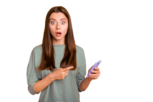 Photo of shocked disquieted girl dissatisfied with her new phone while isolated with vivid yellow background