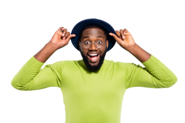 Portrait of impressed funny guy touching his hat screaming wearing green sweater isolated over white background