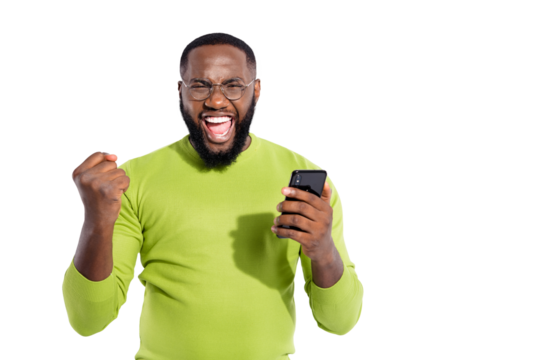 Portrait of cheerful person holding modern technology raising fists screaming yeah having eyewear eyeglasses isolated over white background