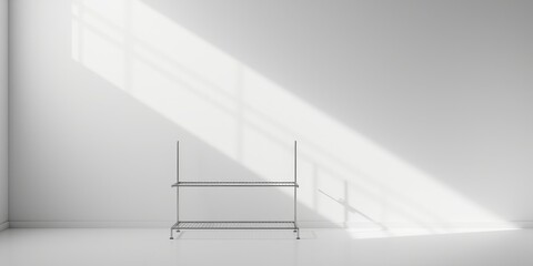 Fototapeta premium Minimalist interior scene with a two-tiered metal rack in sunlight