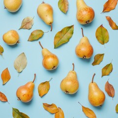 Obraz premium Flat lay of ripe pears and autumn leaves on blue background.