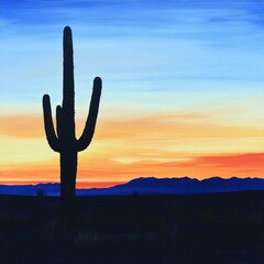 Silhouette of saguaro cactus at sunset in desert landscape.