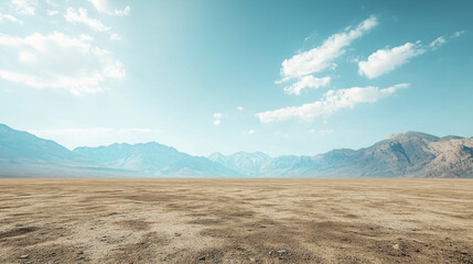 Minimalistyczny krajobraz z równym podłożem, czystym niebem i majestatycznymi górami w oddali, oferujący szeroką przestrzeń na treści promocyjne.