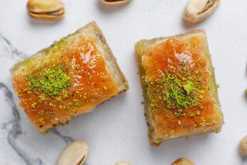 Turkish-style pistachio baklava with a glass of milk.