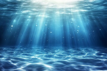 Underwater View Showcasing Sunlight Streaming Through Tranquil Ocean Waves Near a Serene Seafloor During Daytime Hours