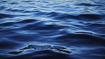 Calm Blue Water Surface with Gentle Ripples Reflecting Natural Light and Creating a Serene and Tranquil Atmosphere for Relaxation or Meditation Purposes