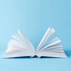 Fototapeta premium Open book with blank pages on blue background.