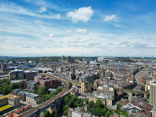Fototapeta premium Central Newcastle City from River Tyne at Northern England United Kingdom. July 19th, 2024, High Angle Drone's Camera Footage Was Captured from Medium High Altitude.