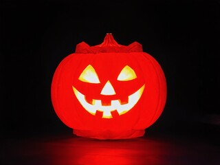 Fototapeta premium Vibrant jack-o'-lantern glowing in dark setting during Halloween celebration