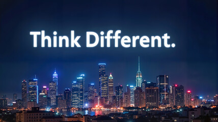 Illuminated city skyline at night with "Think Different" text. Inspirational concept for innovation, travel and modern lifestyle