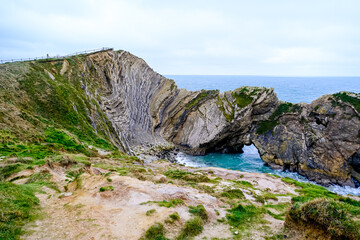 Jurassic coast view in Dorset. Cold winter day. Lulworth Cove cliffs view on a way to Durdle Door. The Jurassic Coast is a World Heritage Site on the English Channel coast. Stair Hole view