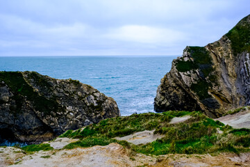 Jurassic coast view in Dorset. Cold winter day. Lulworth Cove cliffs view on a way to Durdle Door. The Jurassic Coast is a World Heritage Site on the English Channel coast. Stair Hole view