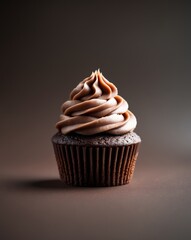 Close up of a chocolate cupcake with creamy frosting decorated in soft swirls on a dark background