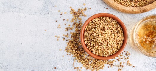 Composition with healthy buckwheat tea on light background with space for text, top view