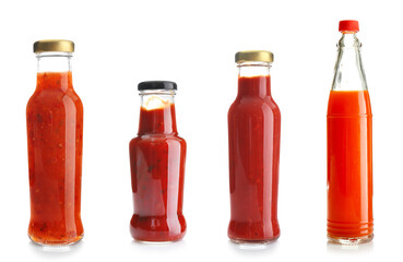 Set of bottles with tasty ketchup on white background