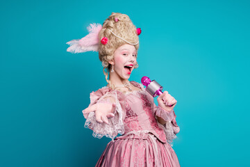Photo of gorgeous positive lady opera theater singer wear pompous gown hold mic sing isolated on blue color background