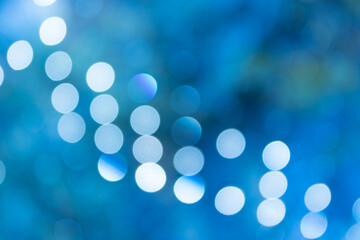 Blue festive Christmas abstract background with bokeh lights and stars. holiday, Christmas and new year