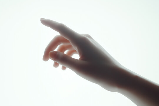 Minimalist Silhouette of Hand Reaching and Pointing in Dramatic Lighting