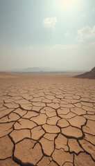 Panorama of dry cracked desert. Global warming concept, dinamic scene, with white tones
