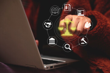 Legal Professional with Justice Icons. A suited legal professional touches virtual icons...
