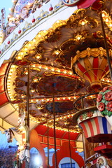 A Beautifully Vibrant Fairground Carousel Bathed in Colorful, EyeCatching Lights