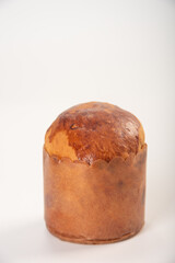 Mini panettone, mini panettone placed on a white surface with a white background, selective focus.