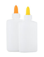 Bottles of glue with caps isolated on white