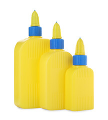 Bottles of glue with caps isolated on white