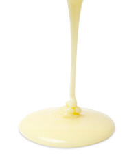 Pouring delicious condensed milk isolated on white