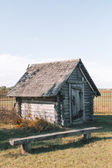 Old Rustic wooden log cabin on nature landscape. 